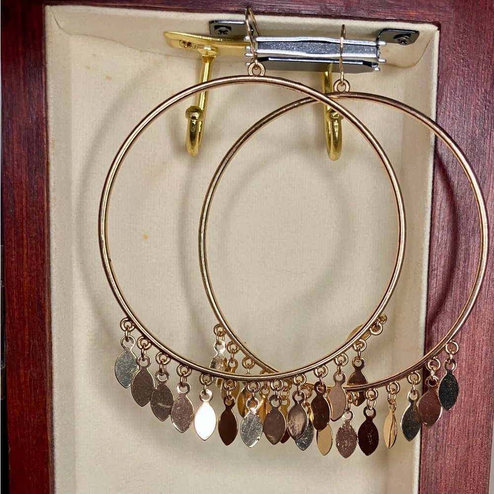 Large gold hoops with dangly charms